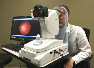 An image of retina being taken by funduscopy.