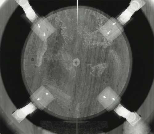 X-ray of the stand of the terrestrial globe (image reconstructed from four plates). The light preparatory layer was laid irregularly, perhaps originally, and is distinguishable with X-rays (it may contain lead white). The growth rings of the wooden stand can also be seen clearly. Metal screws (recent, two in each foot) appear white. (Ill. 22, SIK|ISEA report)